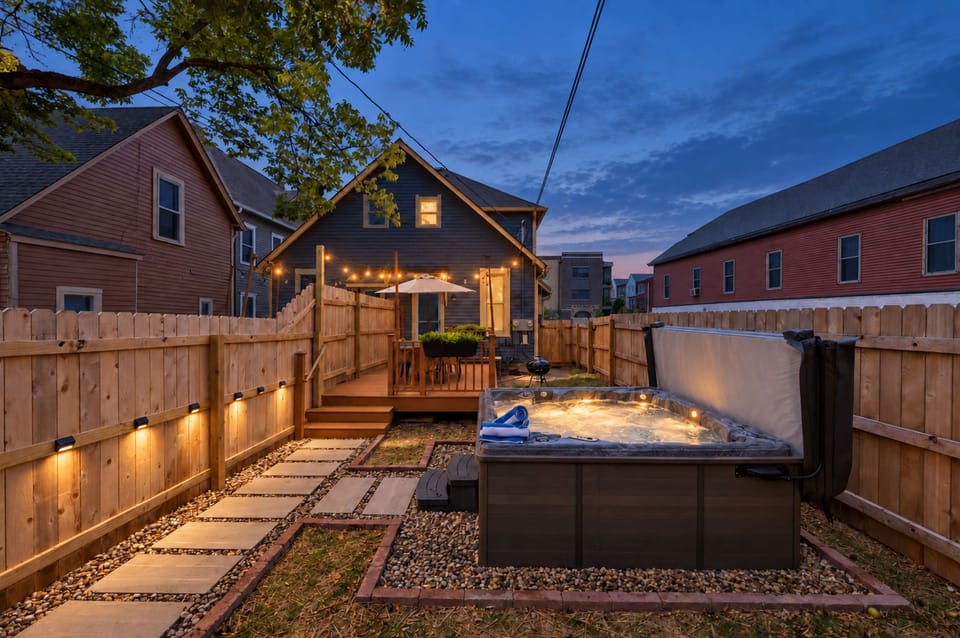 Your private backyard retreat—soak in the hot tub, dine beneath the café lights, and let the evening linger.