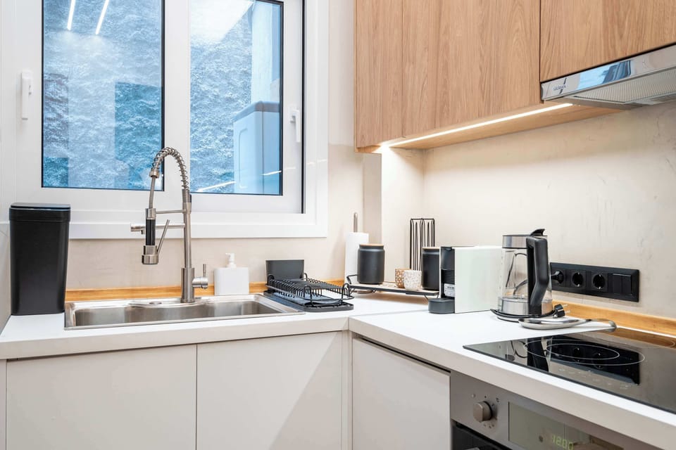 Large windows bring natural light into the kitchen, creating a bright and pleasant environment throughout the day.