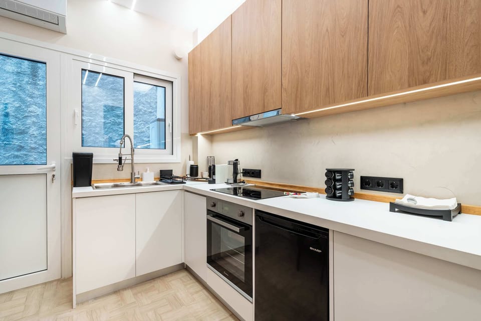 Clean lines, contemporary finishes, and a practical layout make the kitchen a comfortable space for preparing everything from breakfast to evening meals.