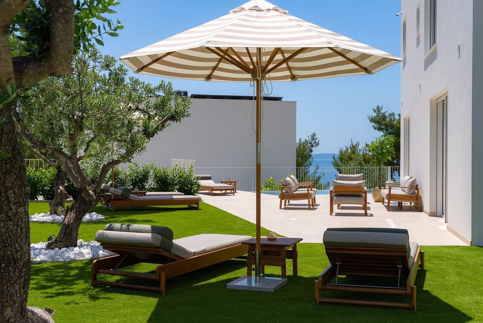 Enjoy a private outdoor pool with a spacious sun terrace, comfortable loungers, and a cozy seating area, this peaceful spot is perfect for relaxing in the sun