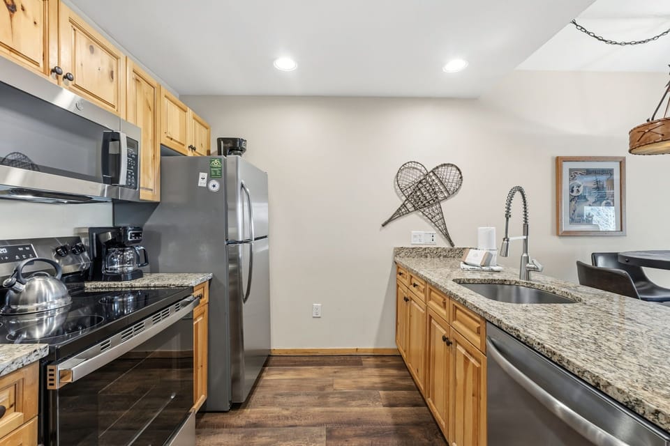 Picture yourself preparing meals in this fully equipped kitchen with granite counters, stainless appliances, and all the cookware you need for a home-cooked getaway feast.