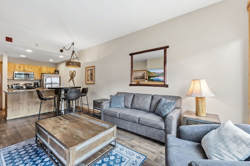 Sink into the plush sofa after a day of adventure, surrounded by rustic mountain touches creating a cozy, welcoming retreat.