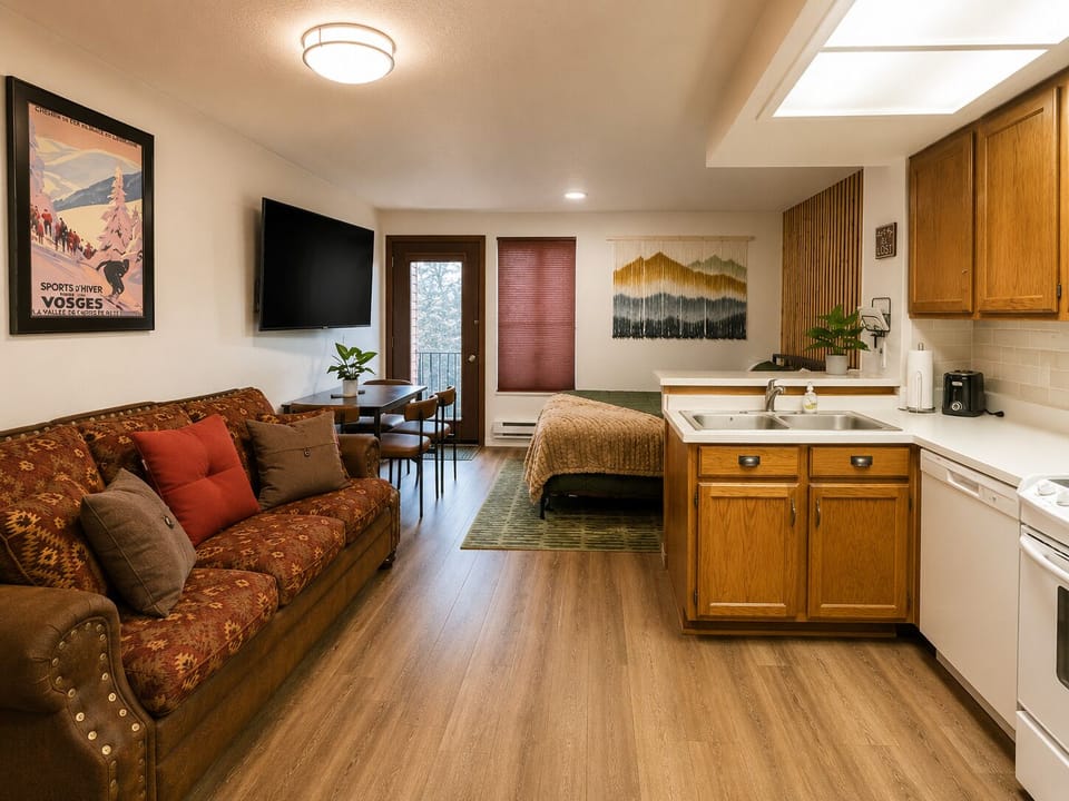 Cozy lounge area with Smart TV, mountain-inspired décor, and space to unwind after a day on the slopes.