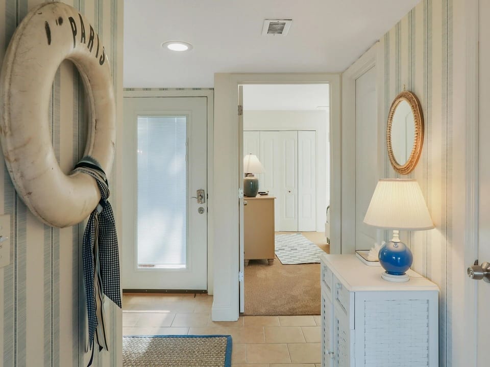 Charming coastal entry welcomes you into the home