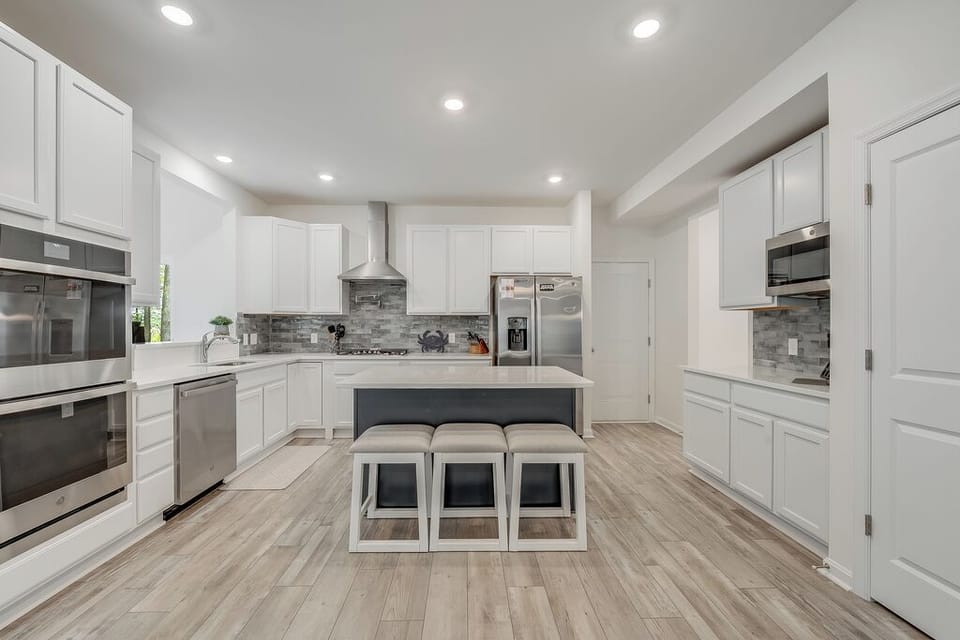 Beachy White Cabinetry and all the bells and whistles.