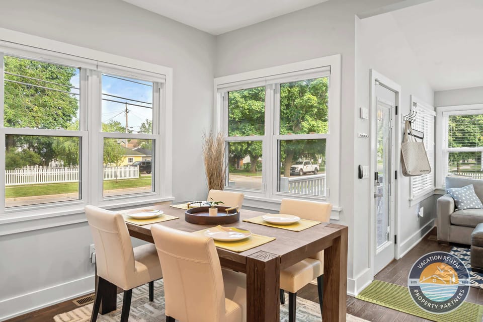 Share meals at the dining table surrounded by large windows, perfect for breakfast, takeout nights, or planning the next day’s adventures.