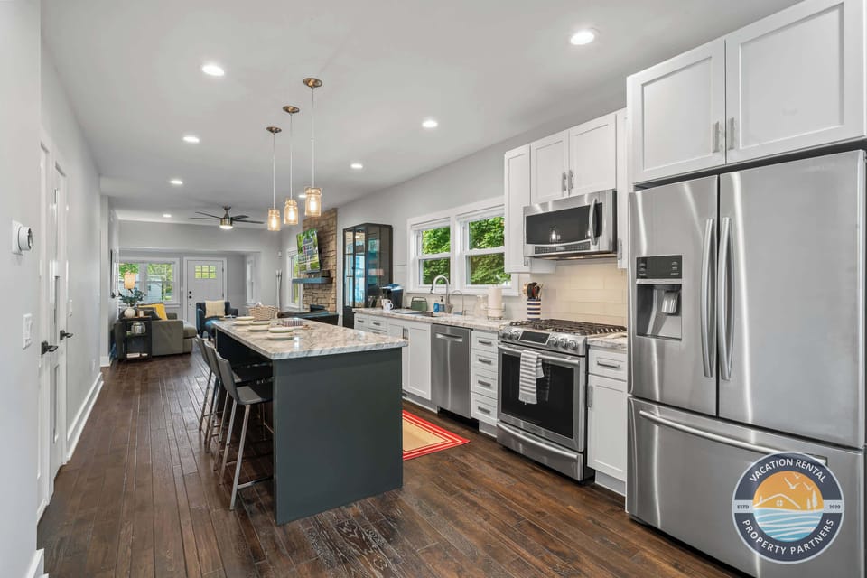 The open kitchen connects easily to the living room, making it simple to cook, serve, and spend time together.