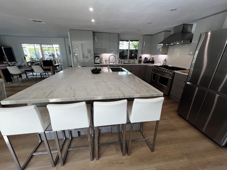 Kitchen with large island and two dishwashers and sinks