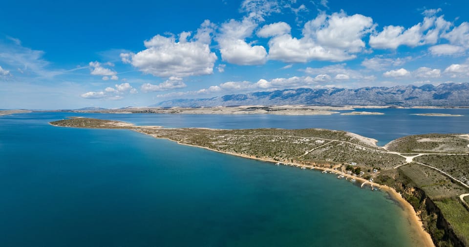 Coastal landscape around Vrsi with clear sea, quiet bays and views of the Velebit mountains.