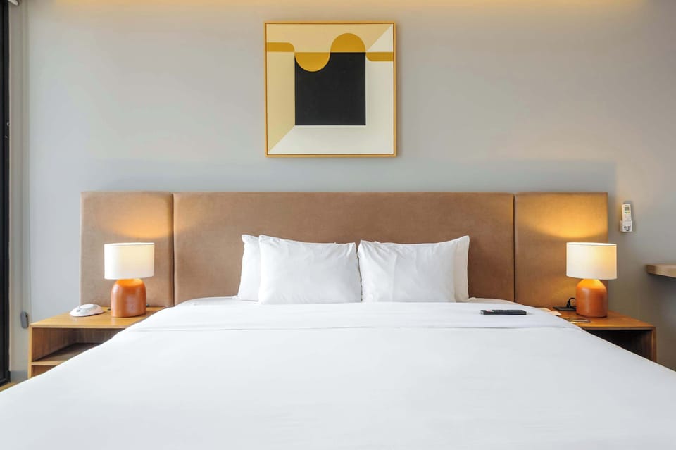 Comfortable bedroom with warm lighting and contemporary décor.