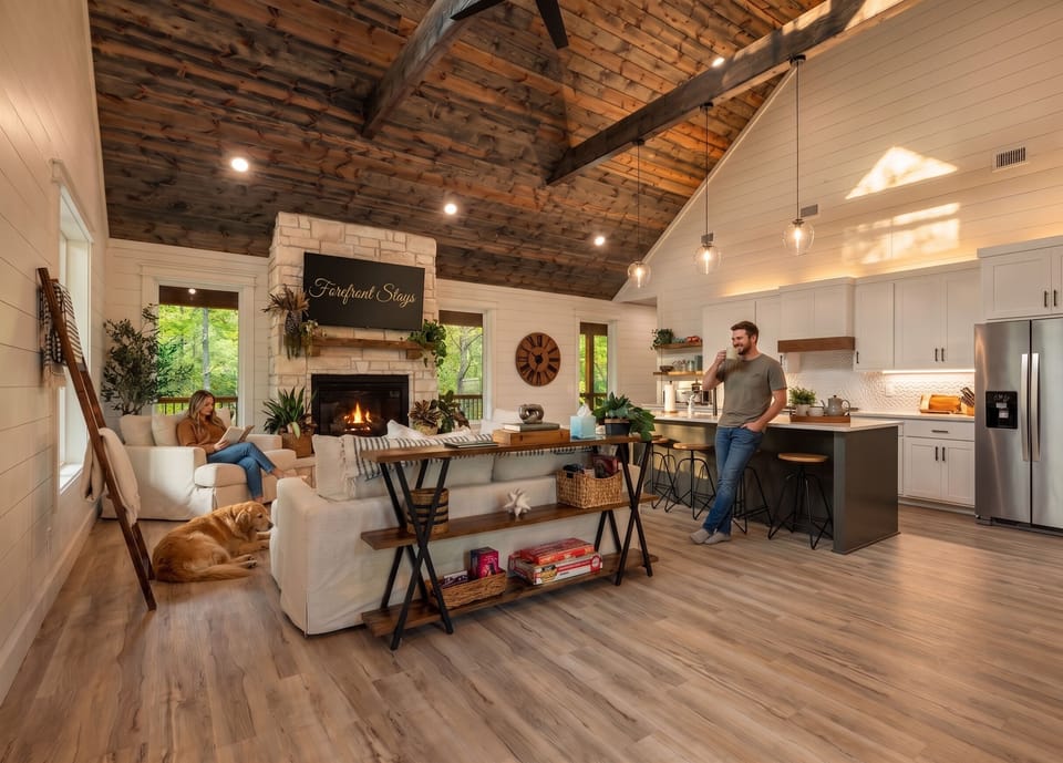 Vaulted great room with stone fireplace, chef’s kitchen, and rustic charm