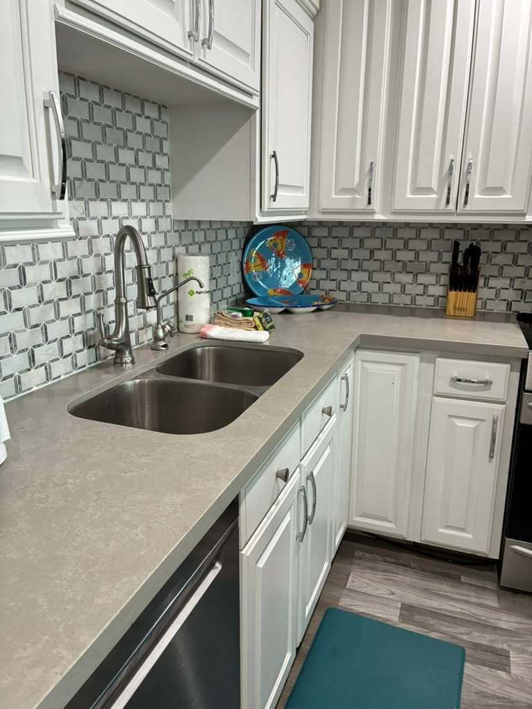 Bright modern kitchen with stylish backsplash and spacious prep area