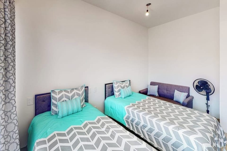 Apartment, Multiple Beds, Patio, Ocean View (Tramonti Condo Tari #107) | 2 bedrooms, individually decorated, individually furnished