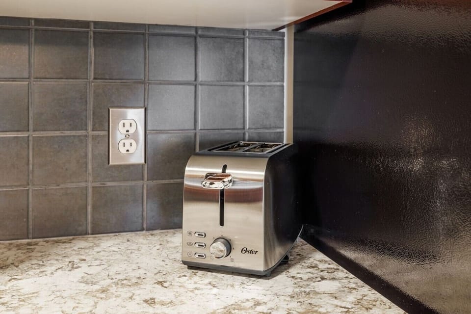 Kitchen equipped with a toaster for your morning meals and snacks.