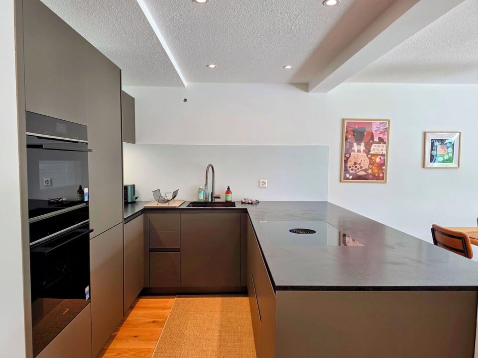 Kitchen, Countertop, Interior Design, Flooring, Kitchen Appliance, Cabinetry, Furniture, Wood, Major Appliance, Ceiling
