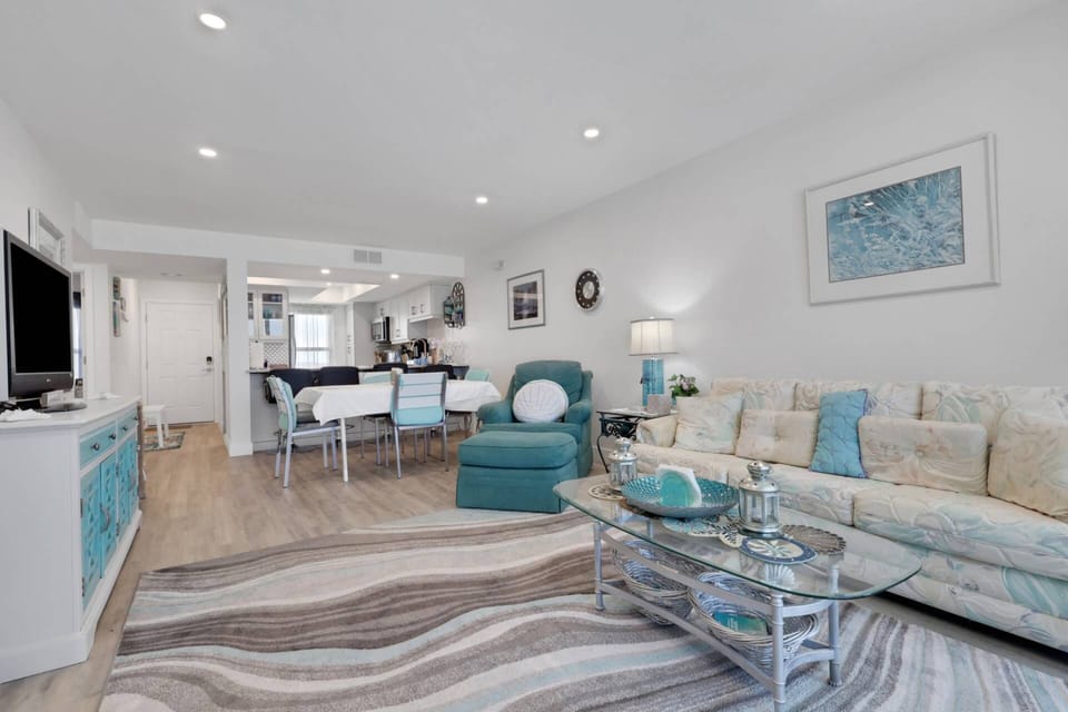 Decorated in soothing coastal hues, the open living space is bright and inviting; the queen sleeper sofa allows for up to 6 guests to share the condo.