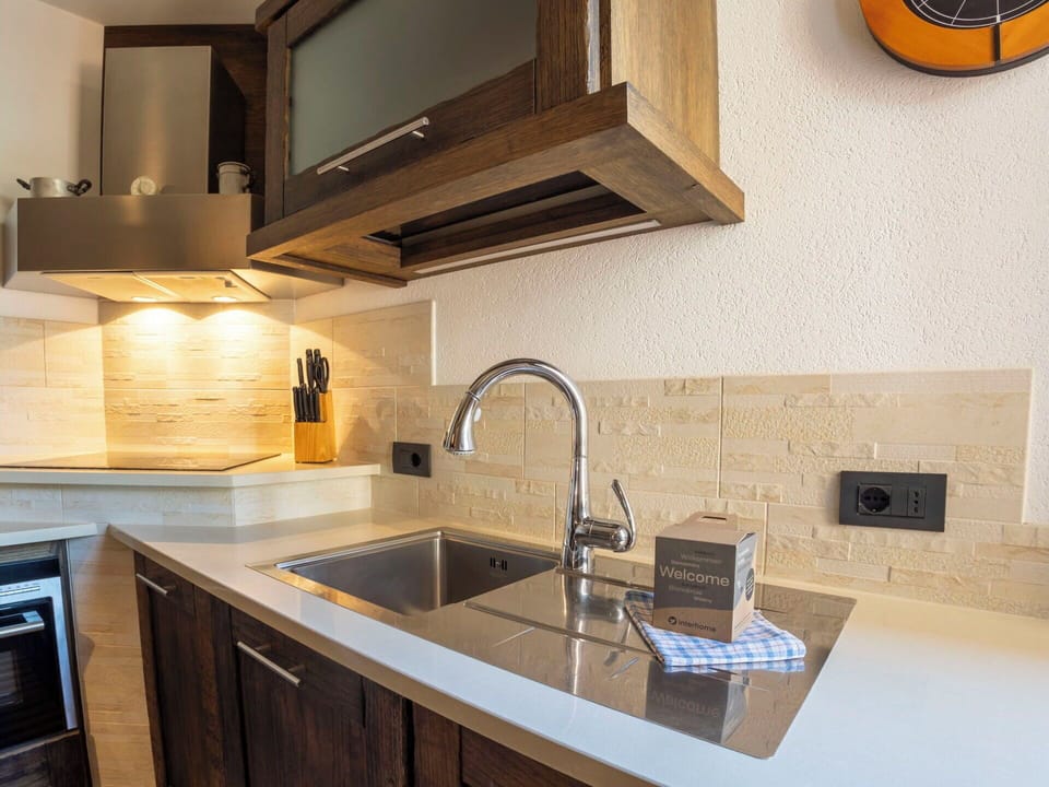 Countertop, Kitchen, Cabinetry, Interior Design, Flooring, Kitchen Appliance, Wood, Plumbing Fixture, Major Appliance, Home Appliance