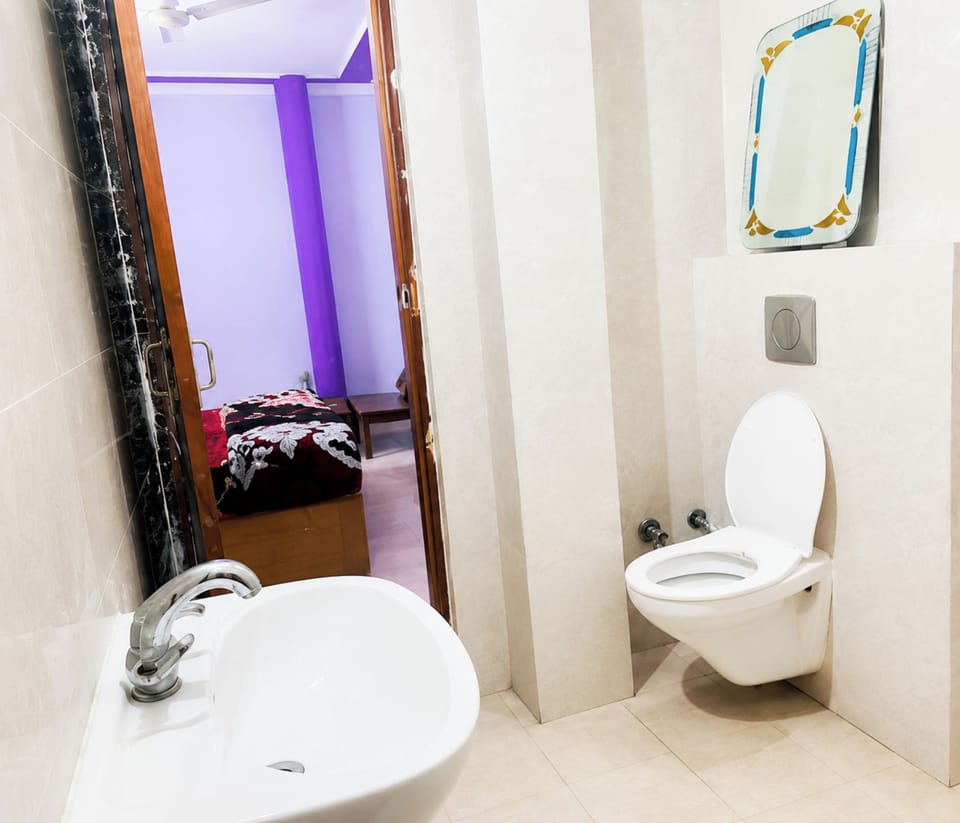 Shower, rainfall showerhead, slippers, towels