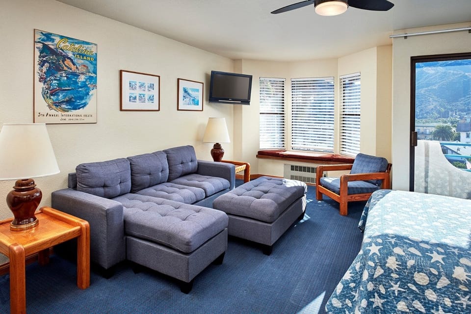 Unwind in a spacious suite with cozy lounge and sunshine.