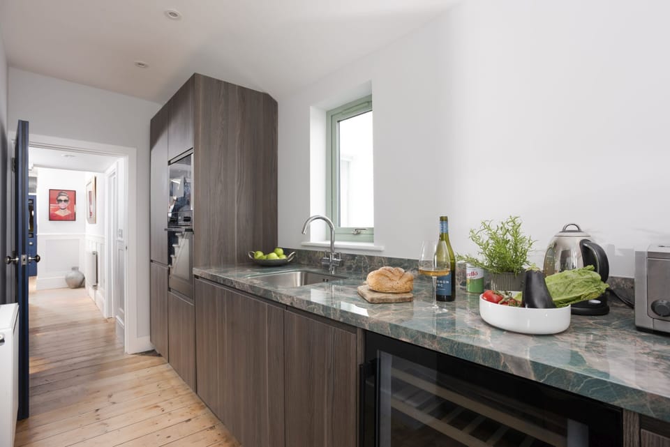 Kitchen area with plenty of cooking space, wine cooler, fridge, freezer - Mermaids 3
