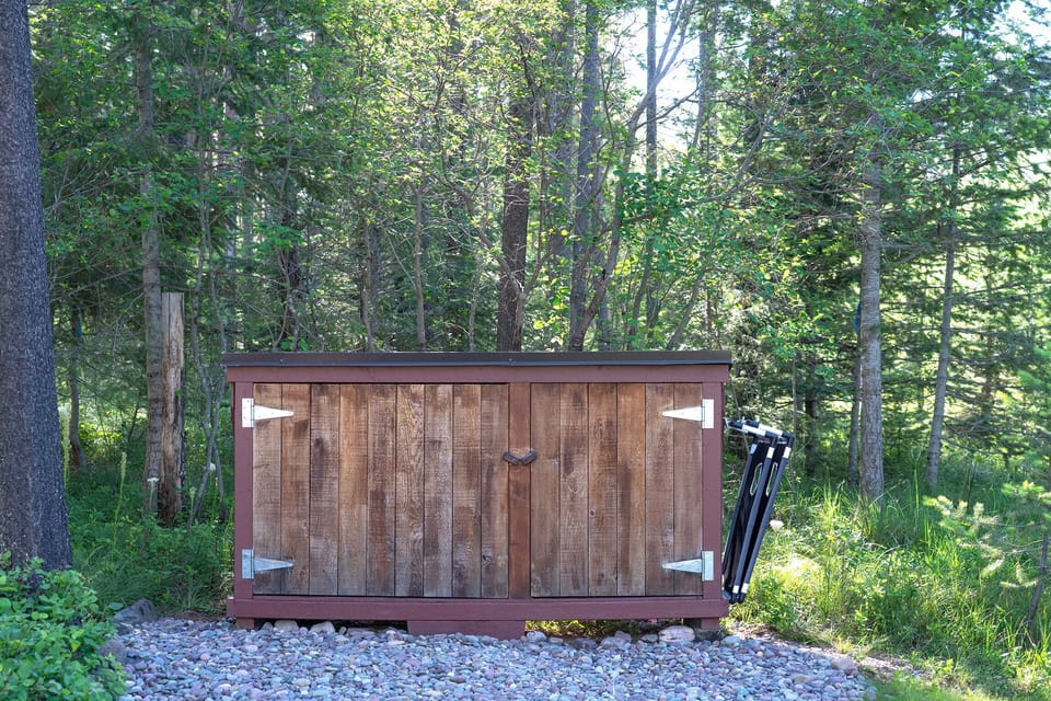 Closed Trash and BBQ grill storage area