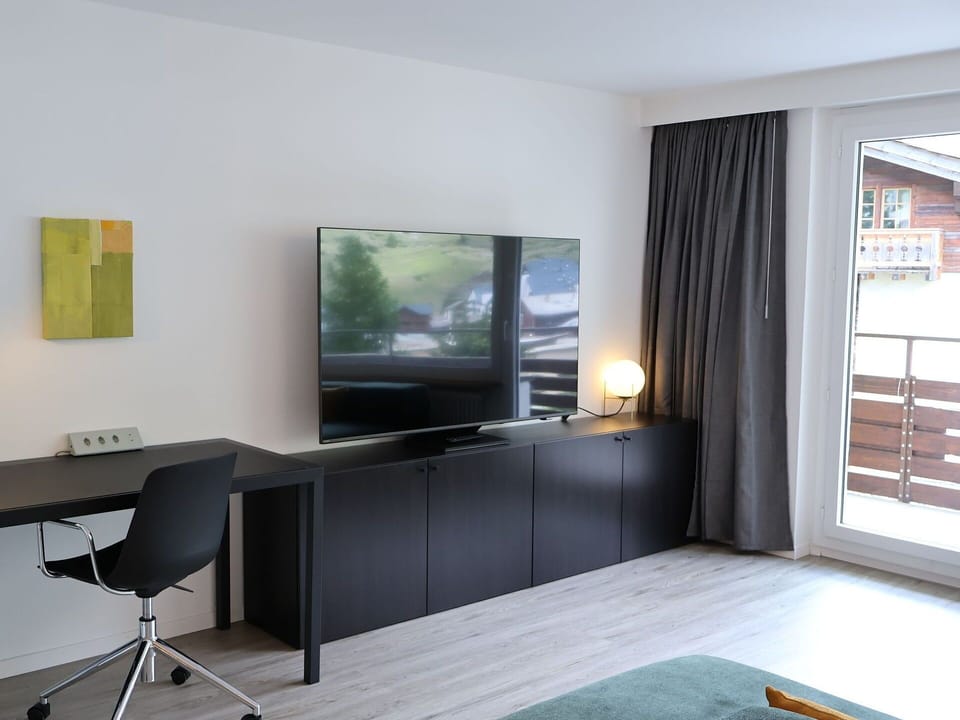 Interior Design, Furniture, Wood, Flooring, Television Set, Floor, Television, Electronic Device, Living Room, Apartment