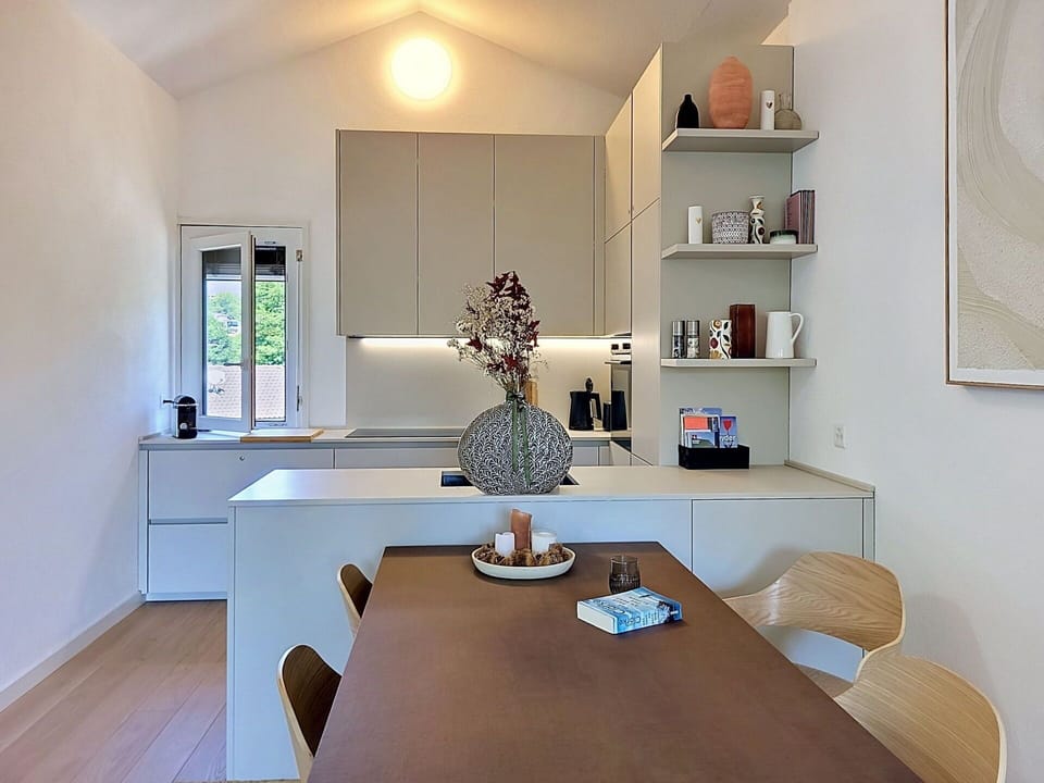 Furniture, Interior Design, Countertop, Kitchen, Flooring, Cabinetry, Wall, Kitchen Appliance, Light Fixture, Wood