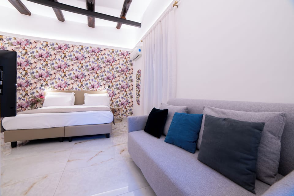 Superior Quadruple Room, City View | In-room safe, blackout drapes, iron/ironing board, WiFi (free)