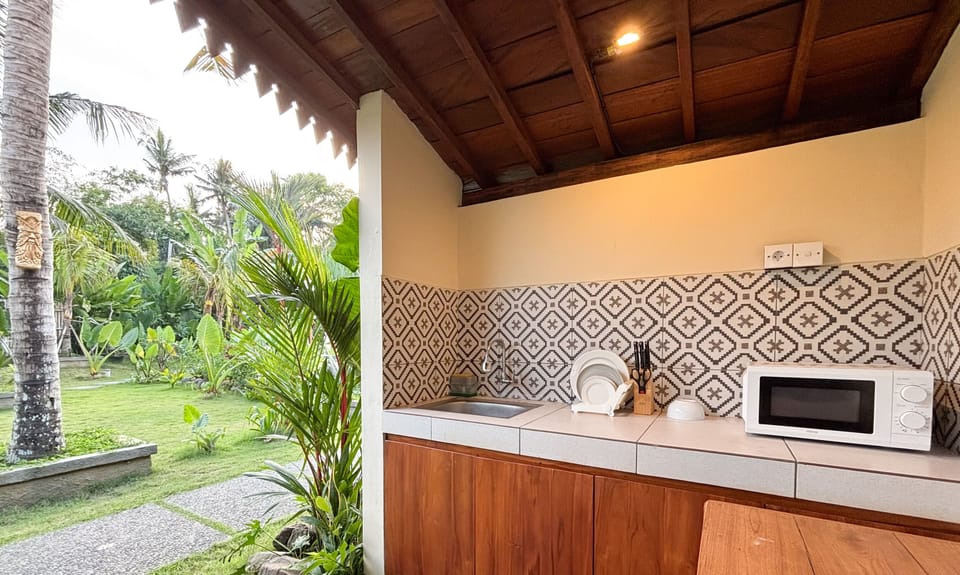 Signature Villa, 1 Bedroom, Microwave, Pool View | Private kitchen | Microwave, dining tables