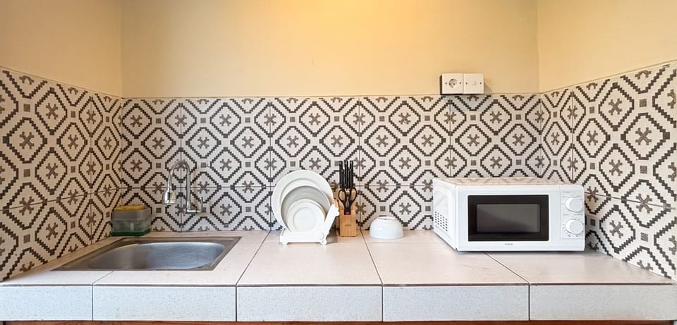 Signature Villa, 1 Bedroom, Microwave, Pool View | Private kitchen | Microwave, dining tables