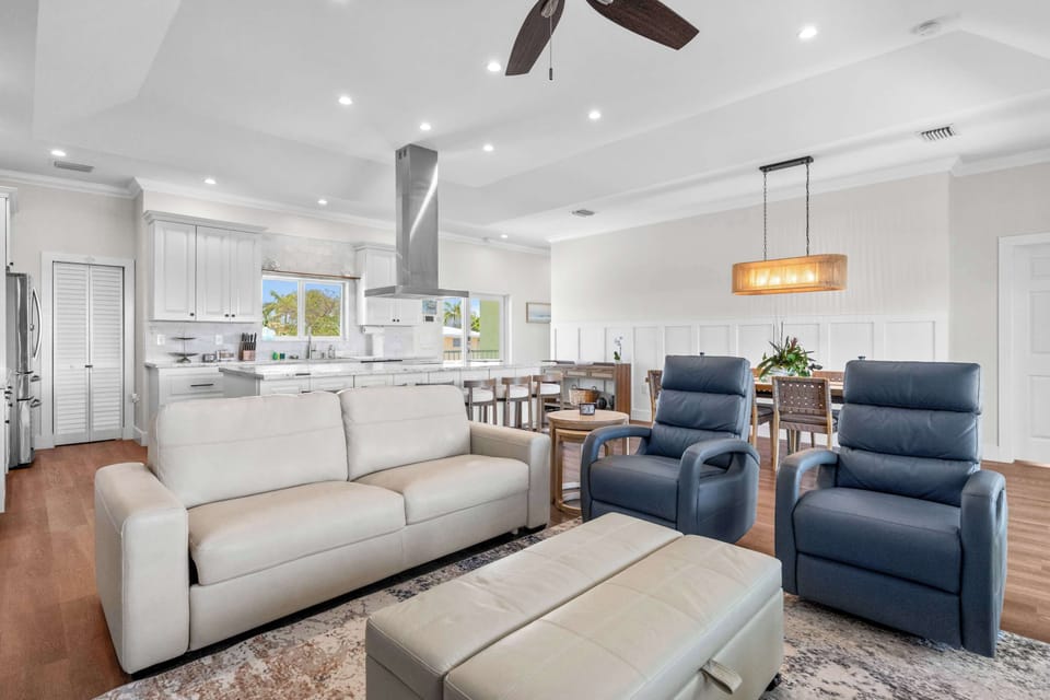 Open Living: The lounge flows into the kitchen so no one misses the conversation.