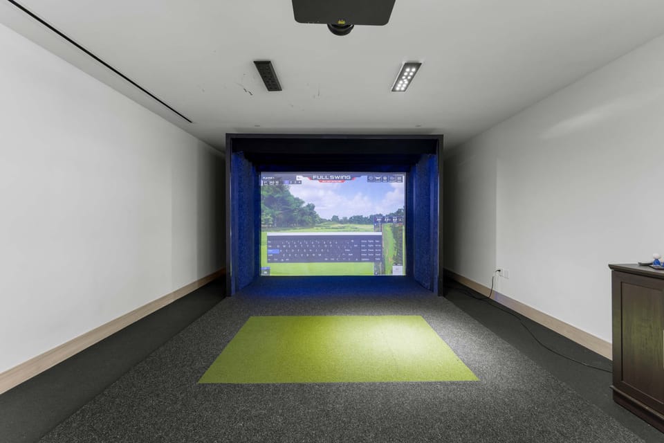 Shared Building Amenity — Full Swing Golf Simulator: A dedicated simulator bay with projector, putting turf, and a full Full Swing setup lets you play famous courses without setting foot off-property.