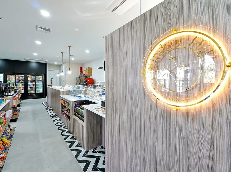 Modern on-site market with snacks, drinks, and a sleek café-style design
