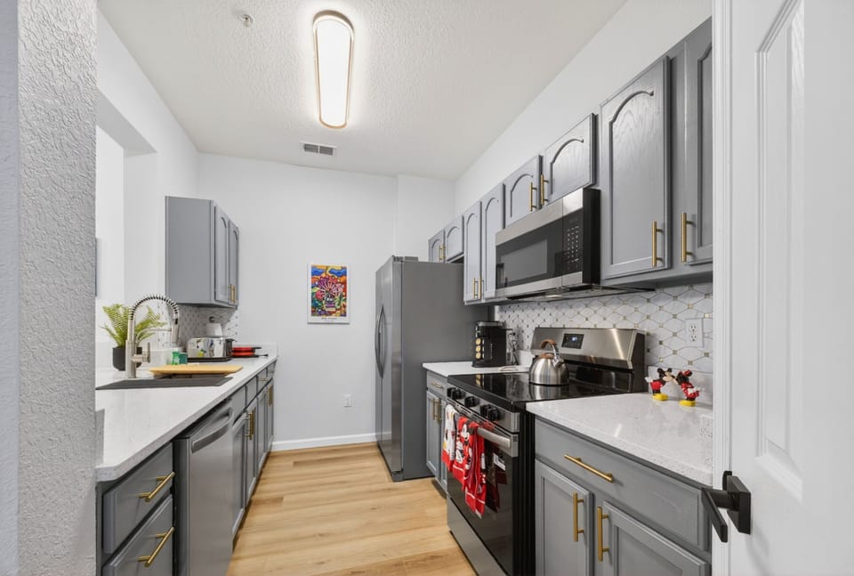 Bright modern kitchen with stainless appliances and stylish finishes