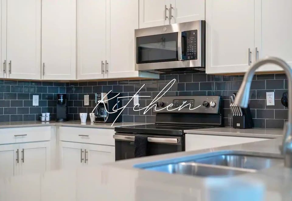 Kitchen: Sleek design with modern appliances for delightful meals and unforgettable gatherings!