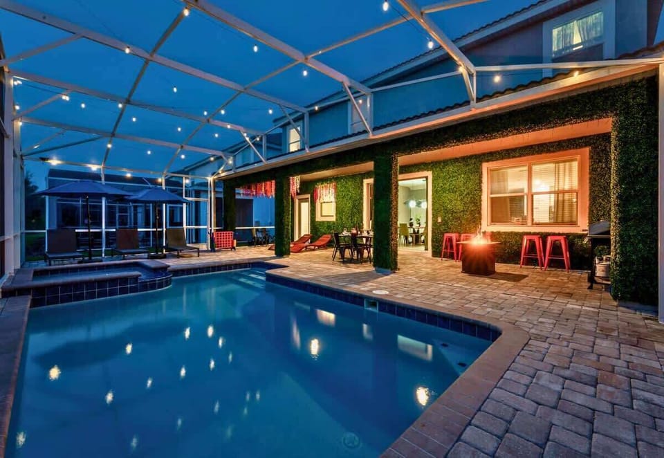 Outdoor Oasis: Dive into relaxation with a stunning pool and twinkling lights for evening fun!