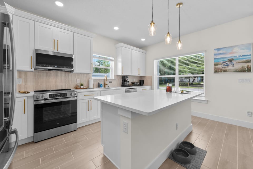 Open kitchen design keeps everyone together across living and dining