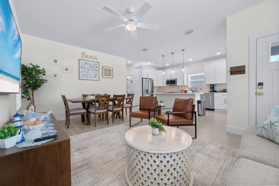 Open dining for six connected to the living room and kitchen