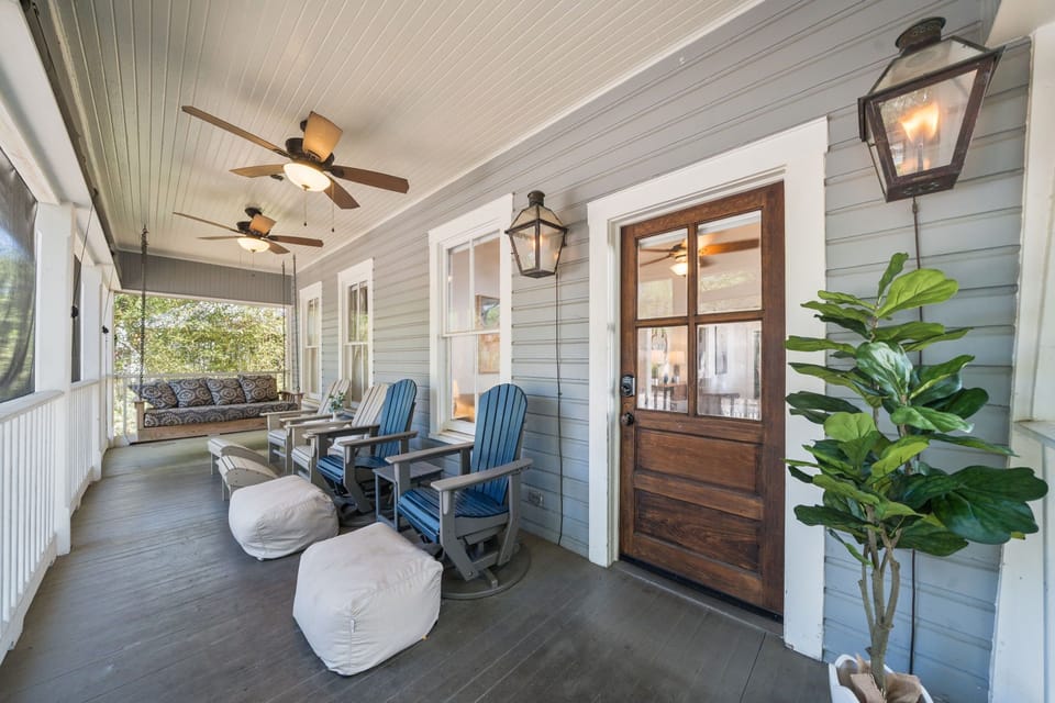 Start your mornings on the spacious screened-in front porch, where Adirondack chairs, a porch swing, and ceiling fans make the perfect spot for coffee at sunrise or a cocktail at dusk.