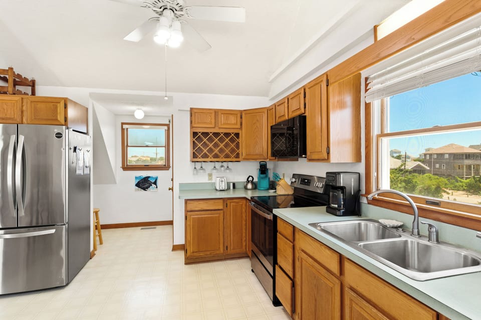 The well-equipped kitchen makes preparing family meals simple and convenient.