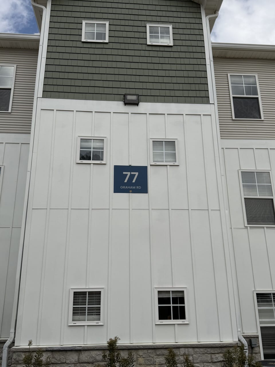Modern exterior with clean design and clearly marked building entry
