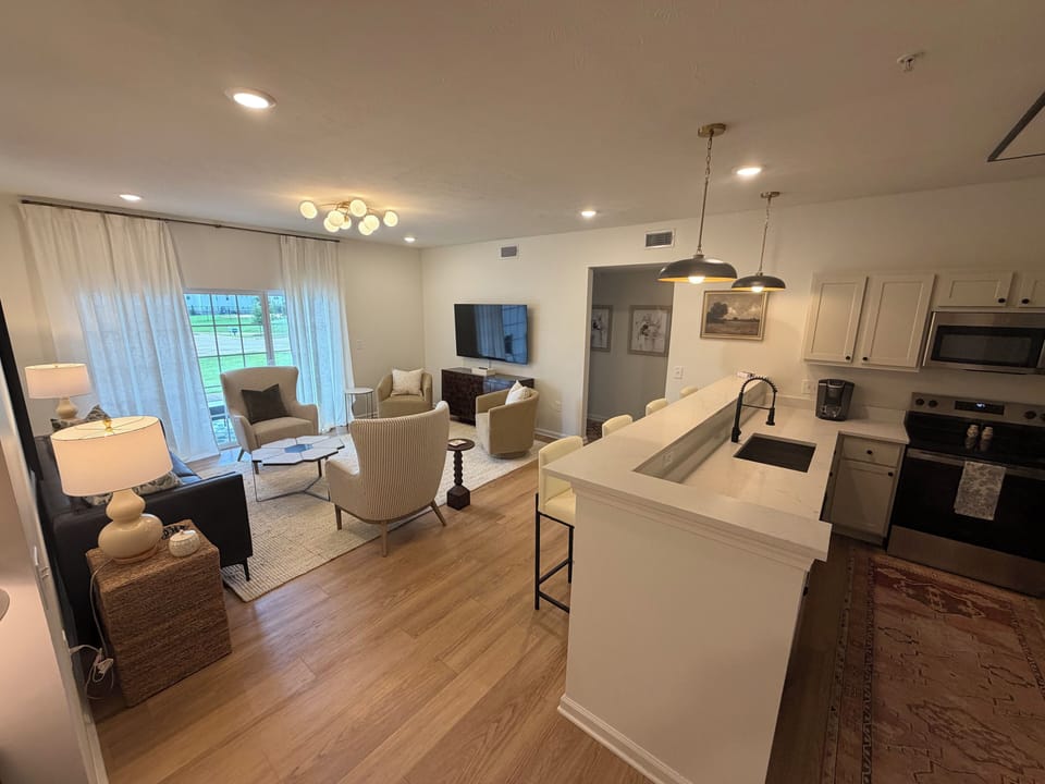 Bright open-concept living space with stylish kitchen and natural light