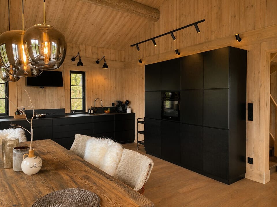 Fully equipped kitchen with cooking essentials and comfortable dining space with seating for the whole family.