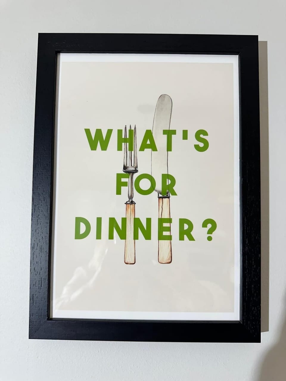 This fun framed kitchen print asks the question on everyone's mind — 'What's for Dinner?' A playful yet stylish addition to the kitchen, it captures the laid-back, welcoming vibe that runs throughout the whole apartment.
