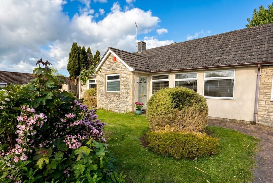 Charming stone bungalow with pretty cottage garden welcomes you in