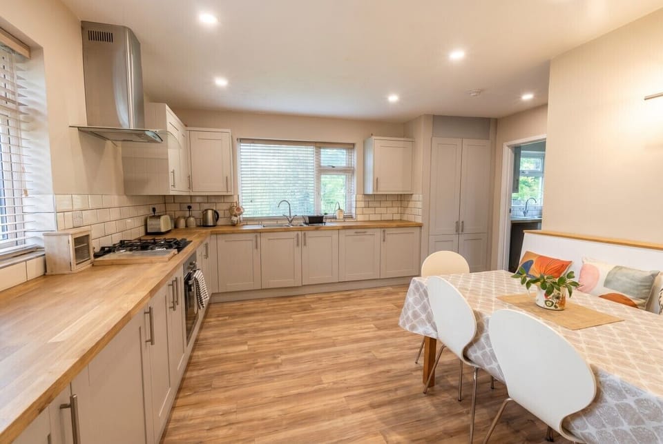 Bright shaker kitchen with breakfast seating made for family mornings