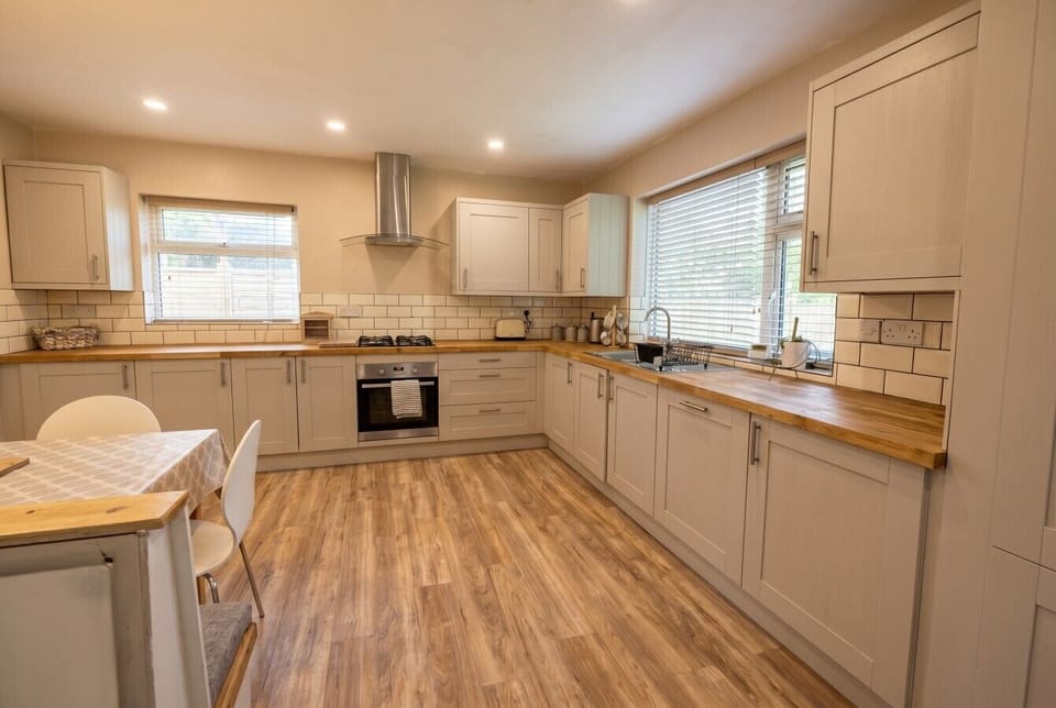 Light-filled kitchen with ample counter space and dining for all
