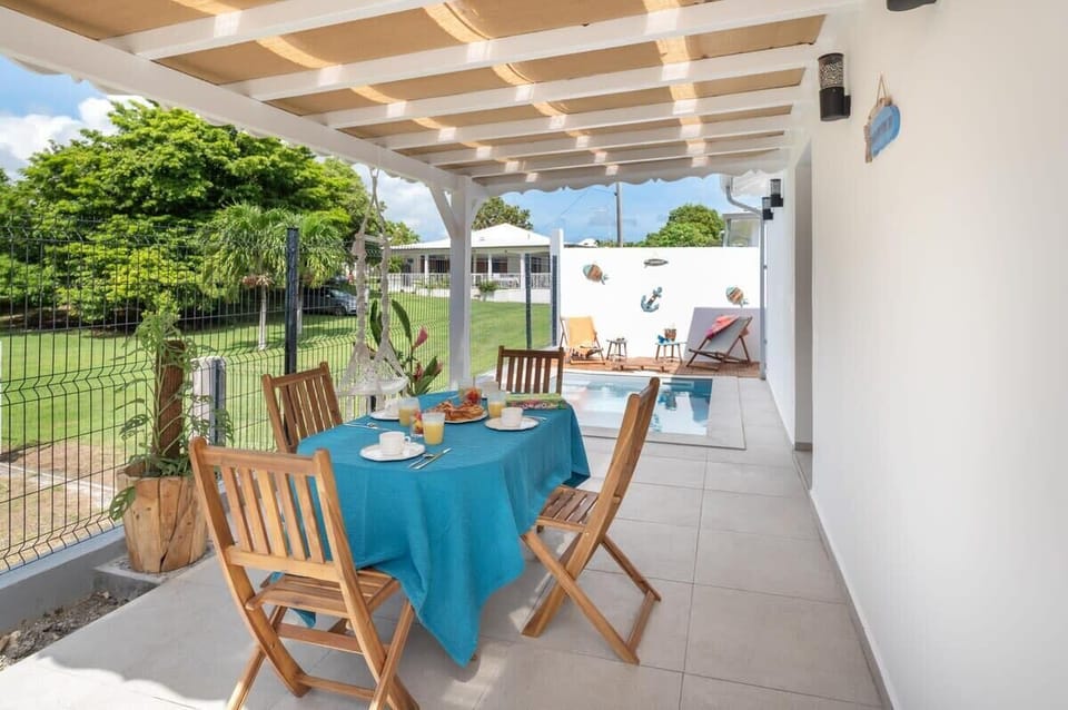Dining table with garden and pool views