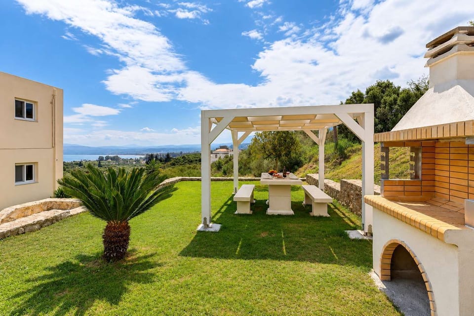 Enjoy meals outdoors in the shared BBQ area while admiring the sea and mountain views.