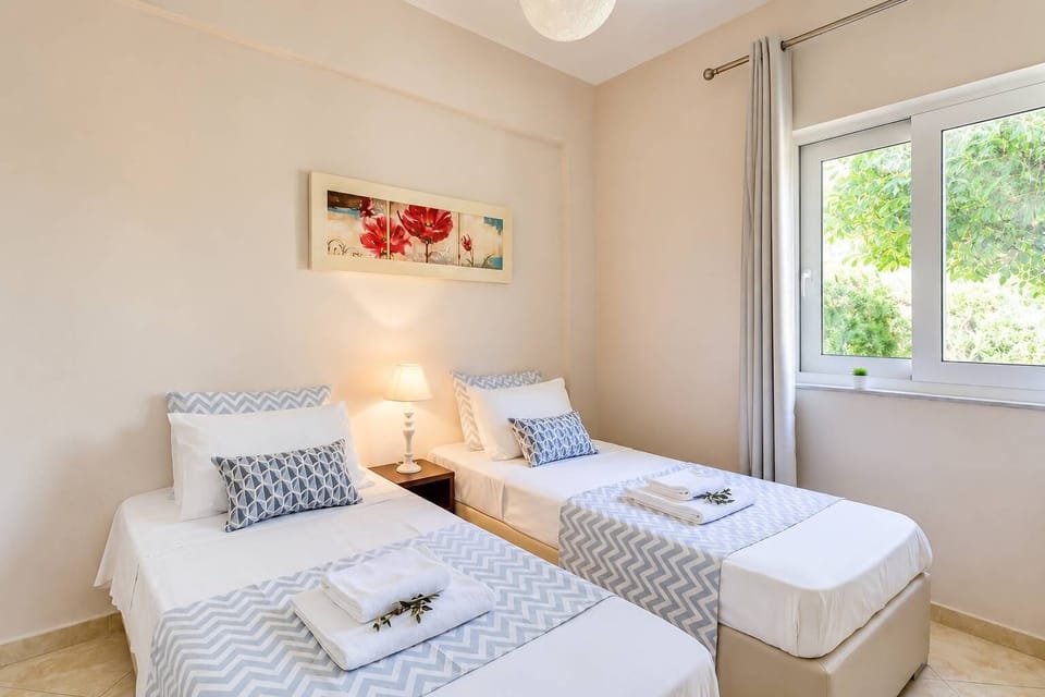 Bright twin bedroom ideal for children, friends, or additional guests.